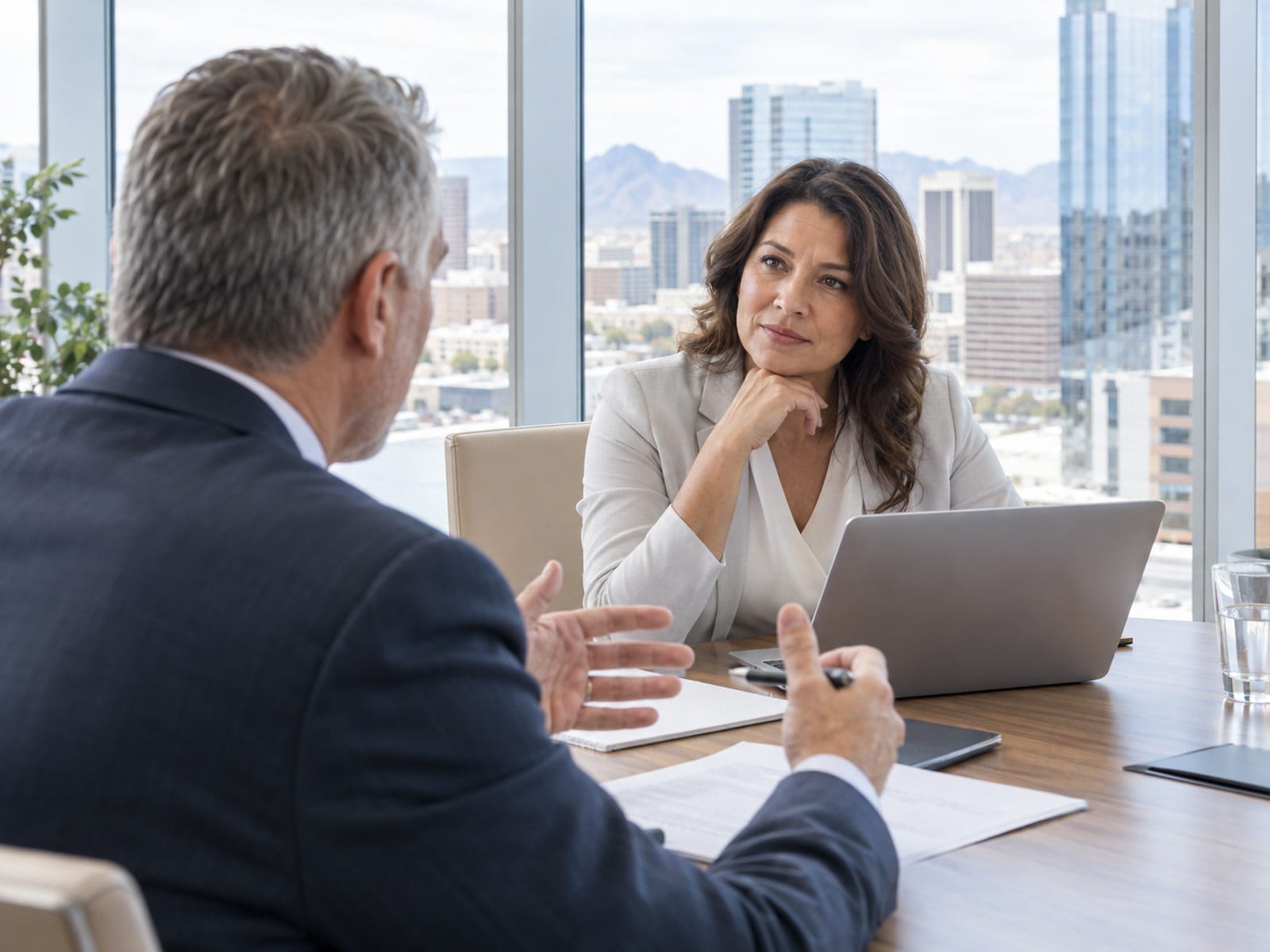 Two executives in a quiet corner conversation in a Phoenix office