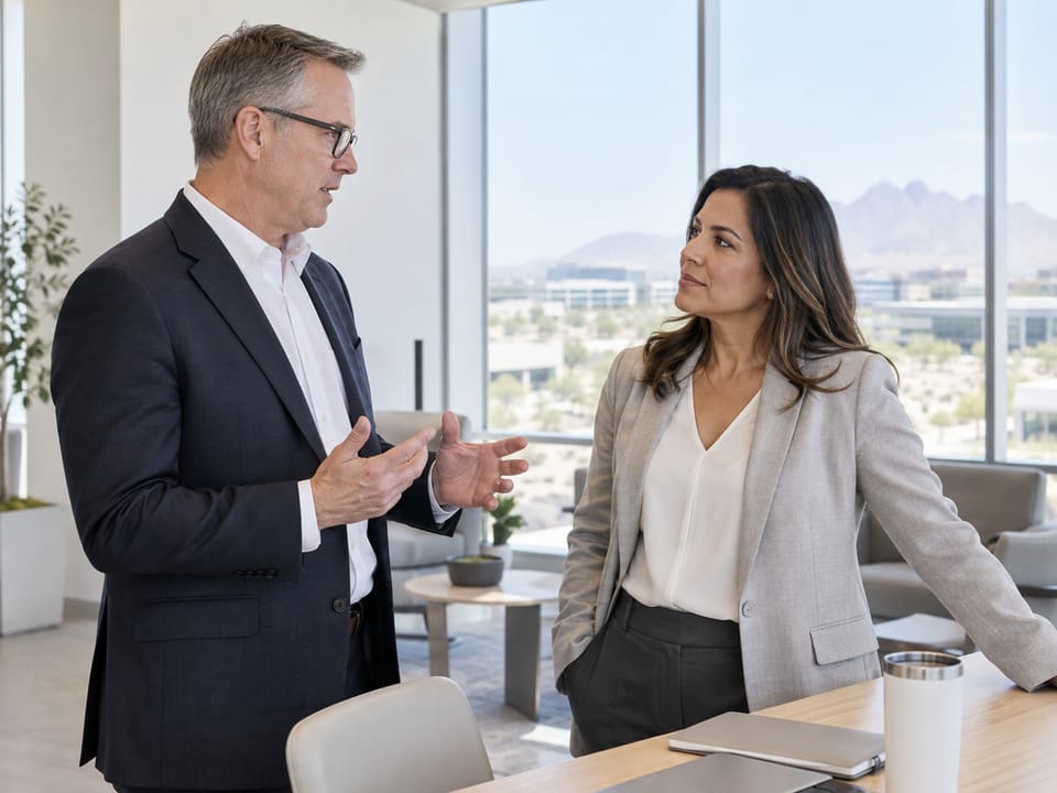 Executives in conversation in a modern Chandler technology office, no logos, no readable text