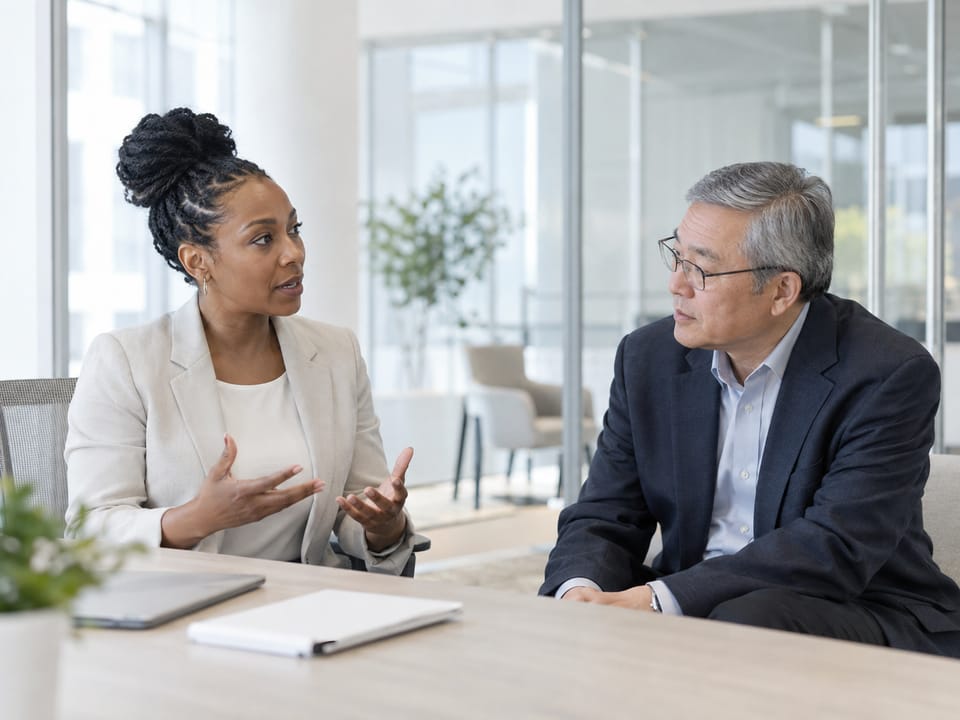 Executives in conversation in a modern Glendale office, no logos, no readable text